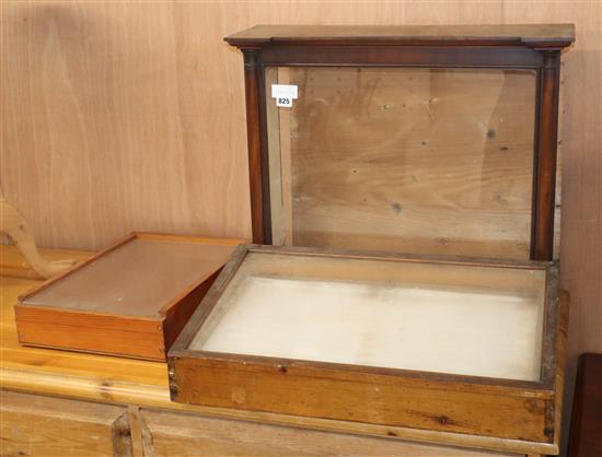 Three glazed display cases Largest W.64cm